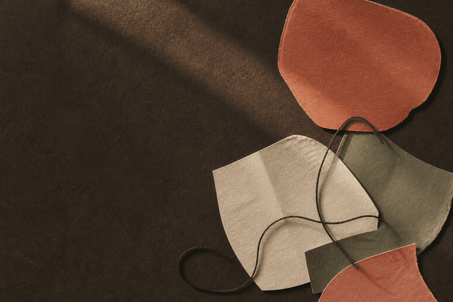 Abstract warm paper collage stitched together with thread